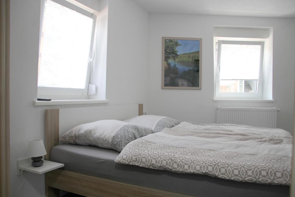Postel nebo postele na pokoji v ubytování Gästehaus Nebenan