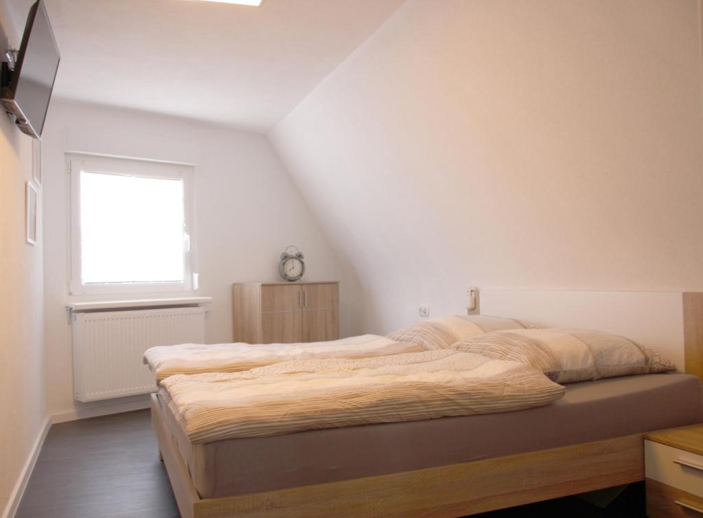 Postel nebo postele na pokoji v ubytování Gästehaus Nebenan