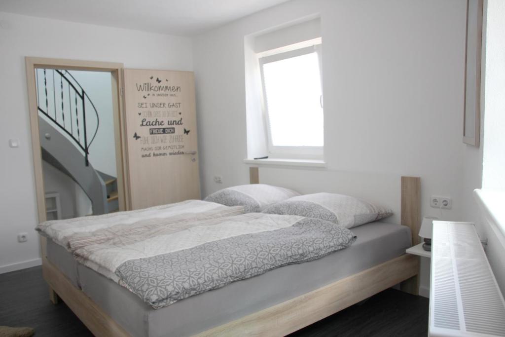 Postel nebo postele na pokoji v ubytování Gästehaus Nebenan