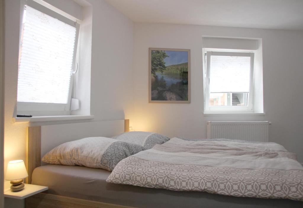 Postel nebo postele na pokoji v ubytování Gästehaus Nebenan