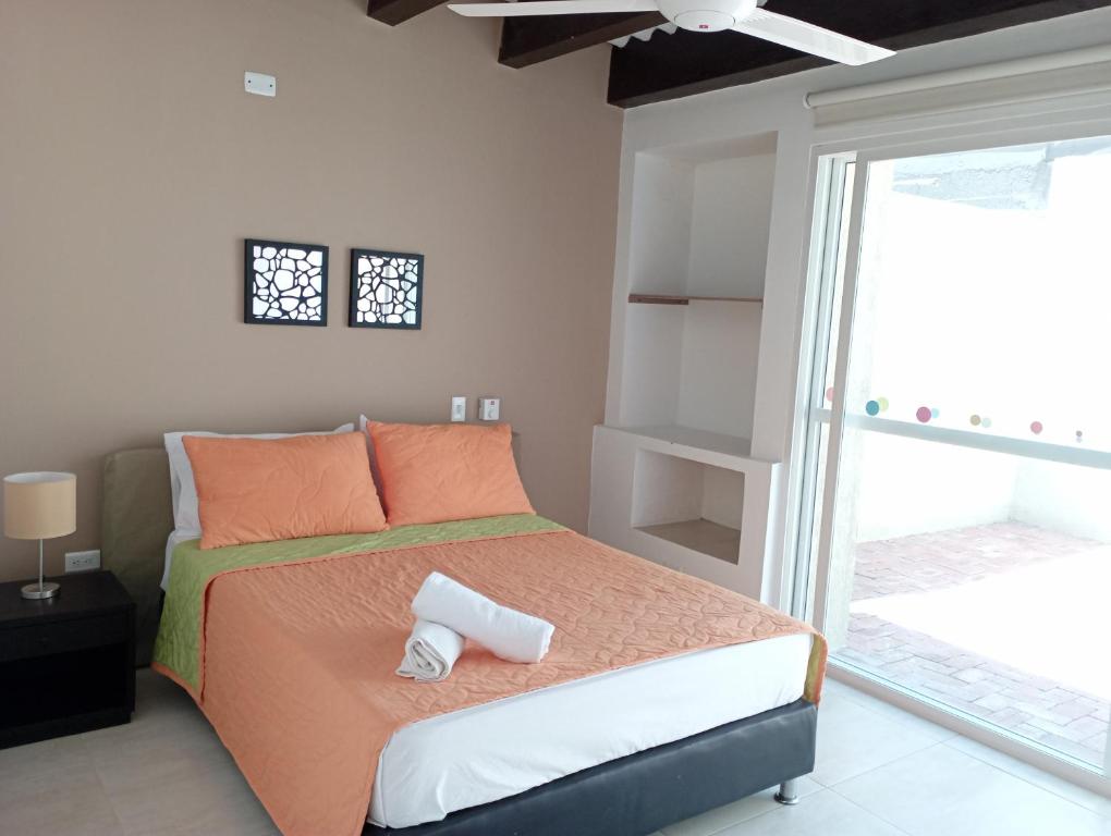 Postel nebo postele na pokoji v ubytování Hotel TACALOA INN EXPERIENCE