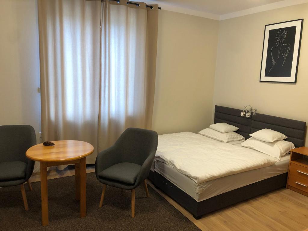 Posteľ alebo postele v izbe v ubytovaní Apartamenty JN Poznań Rzeczna 4