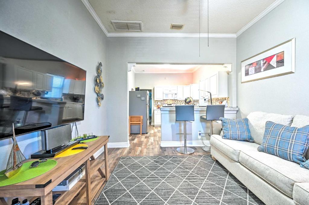 a living room with a couch and a kitchen at Updated Ybor City Duplex about half Mi to Seventh Ave! in Tampa
