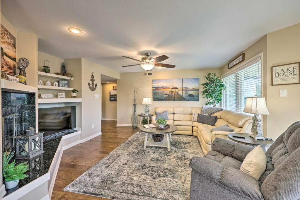a living room with a couch and a fireplace at Beautiful Hot Springs Condo with Lake Hamilton Views in Hot Springs