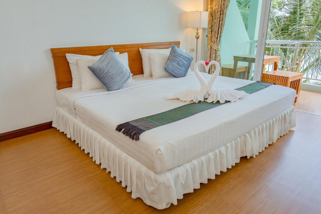 Postel nebo postele na pokoji v ubytování Mam Kaibae Hotel