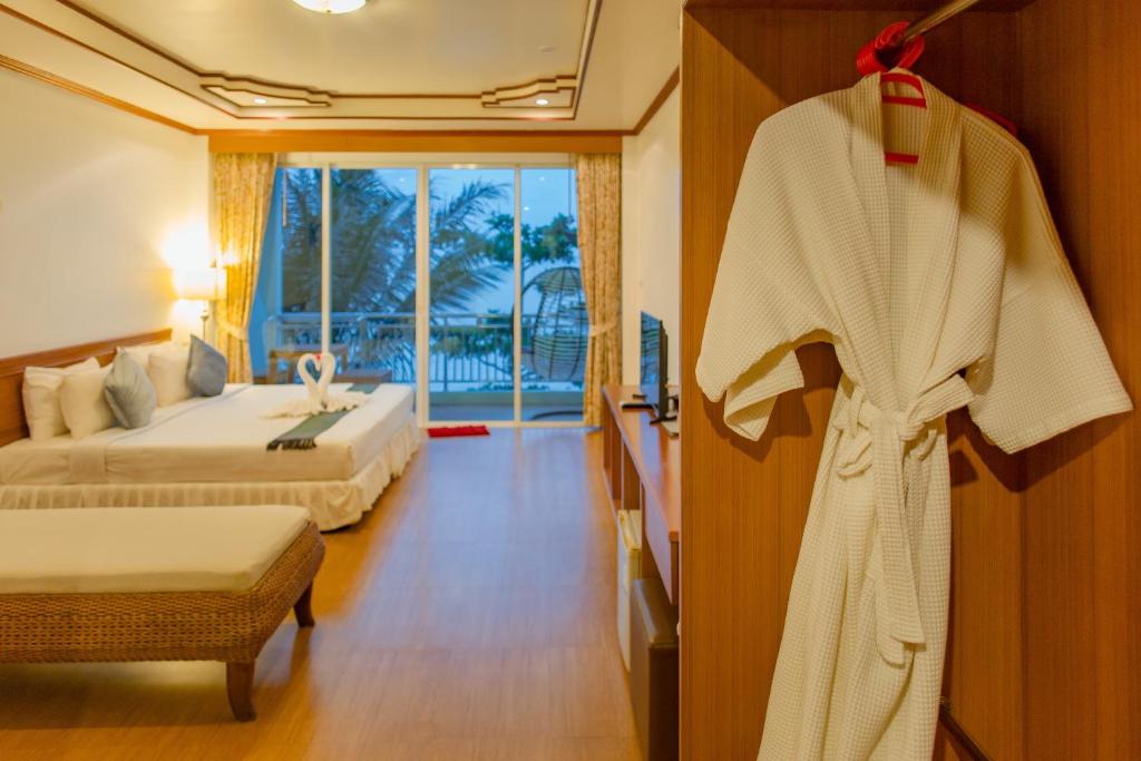 Postel nebo postele na pokoji v ubytování Mam Kaibae Hotel