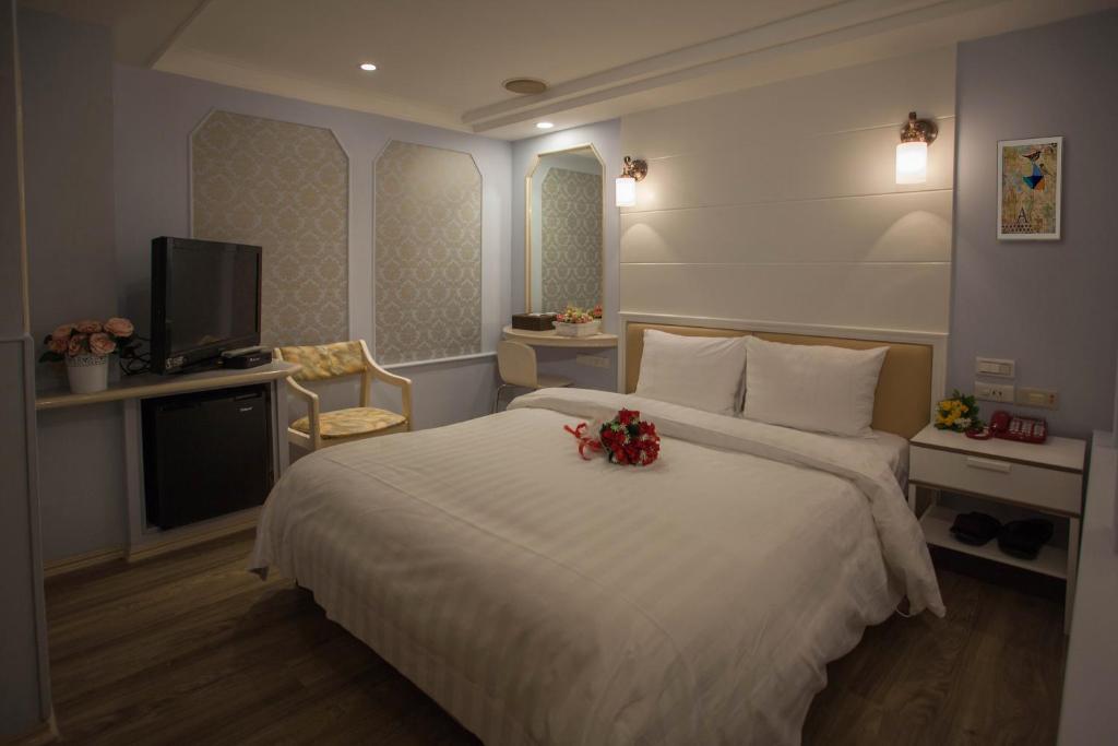Postel nebo postele na pokoji v ubytování Showart Hotel