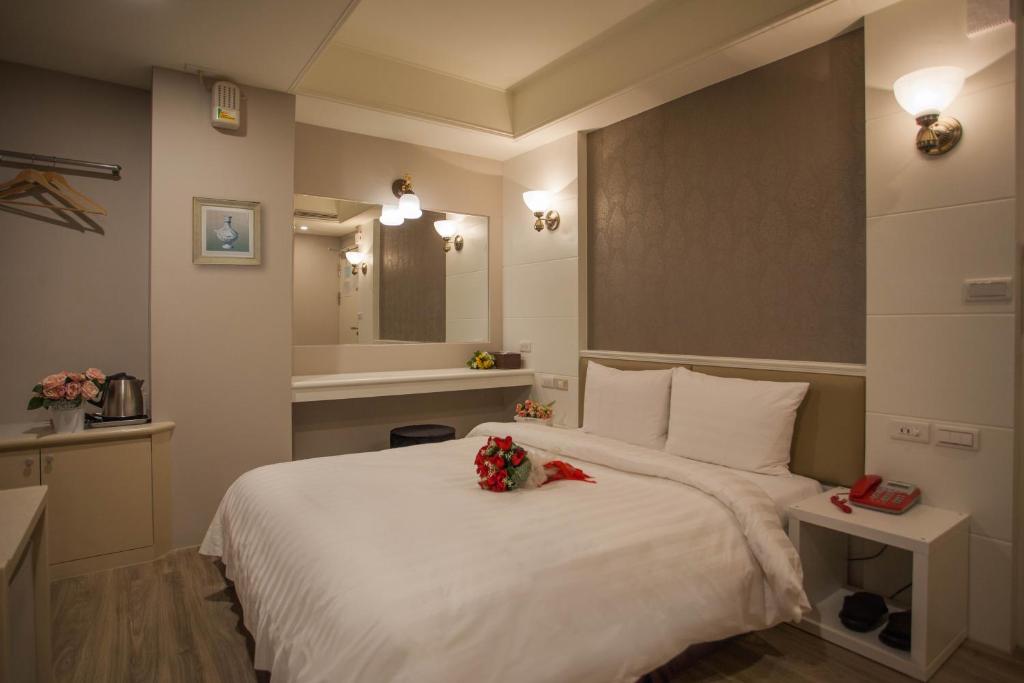 Postel nebo postele na pokoji v ubytování Showart Hotel
