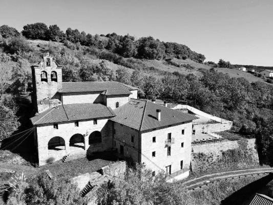 a black and white photo of a church on a hill at Palacio de Aralar Grande in Oskotz