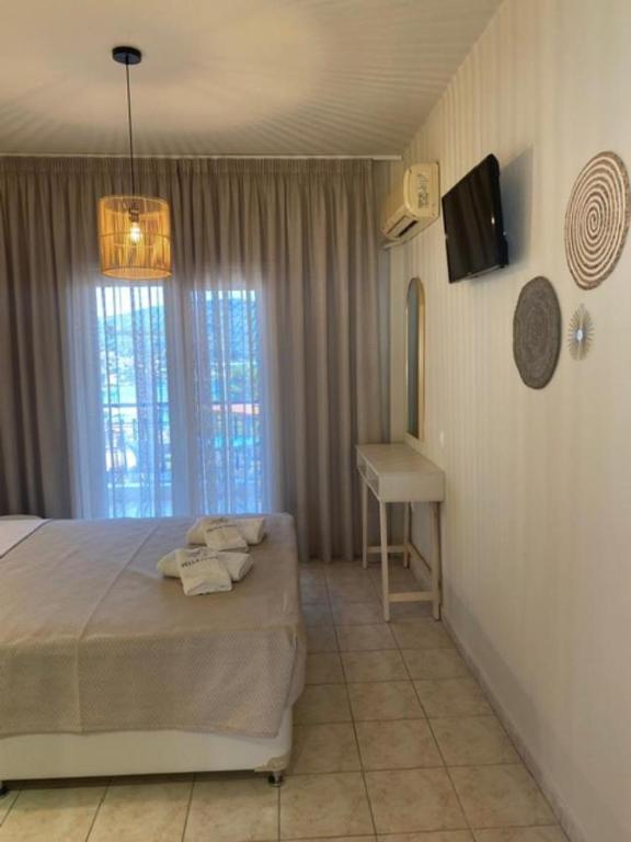 Postel nebo postele na pokoji v ubytování Pella Hotel - new