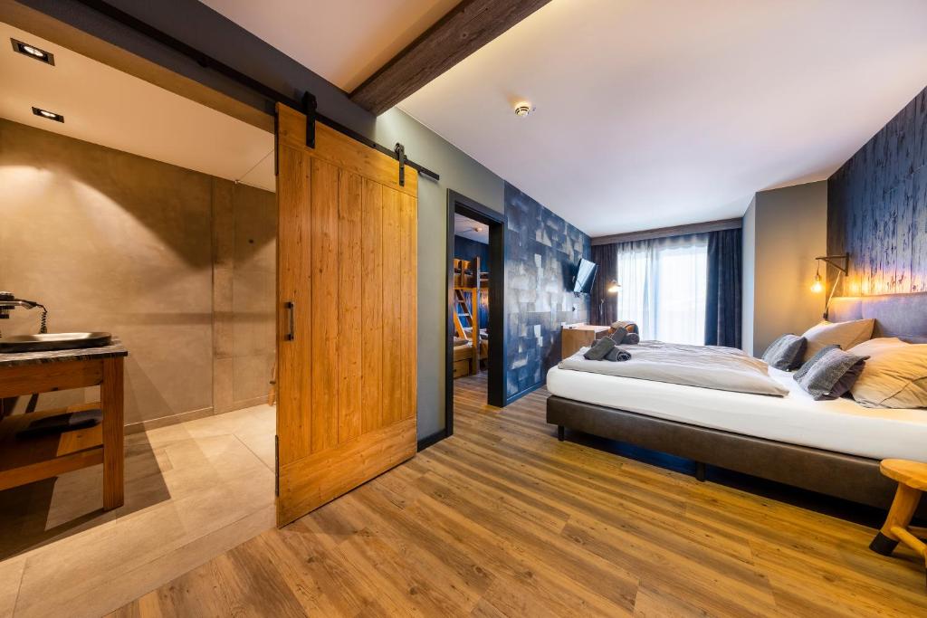 Postel nebo postele na pokoji v ubytování Herz3 Hotel Bar Restaurant Trattoria