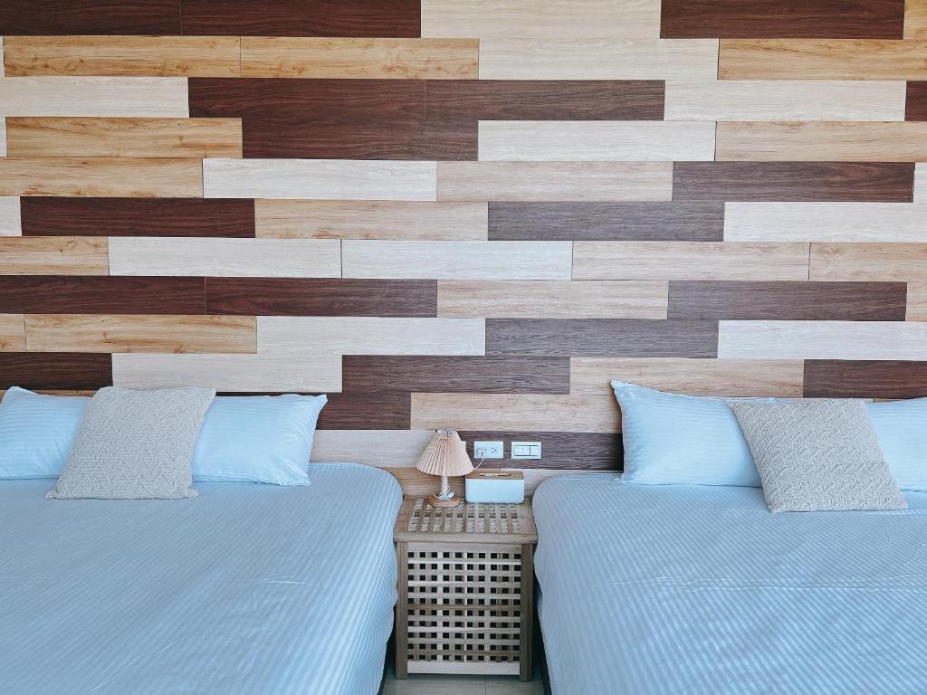 Postel nebo postele na pokoji v ubytování Wei Wei Chu B&B