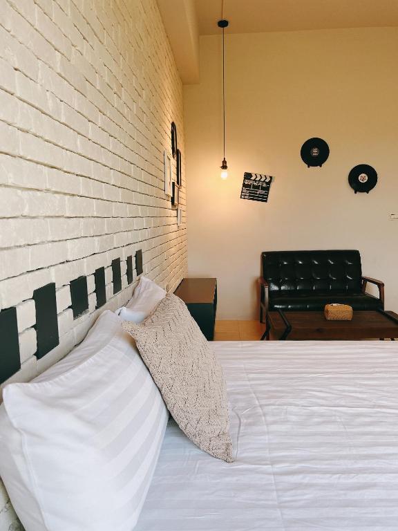 Postel nebo postele na pokoji v ubytování Wei Wei Chu B&B