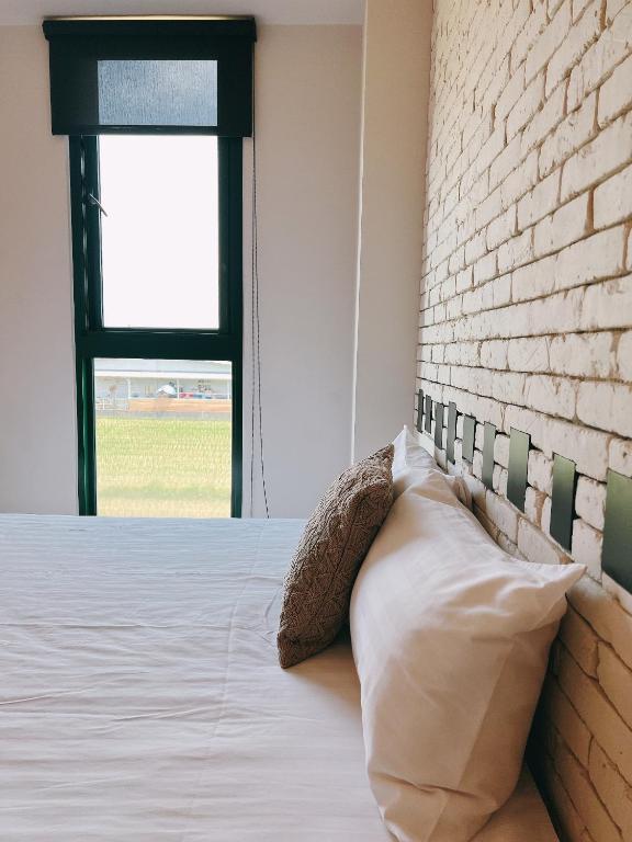 Postel nebo postele na pokoji v ubytování Wei Wei Chu B&B