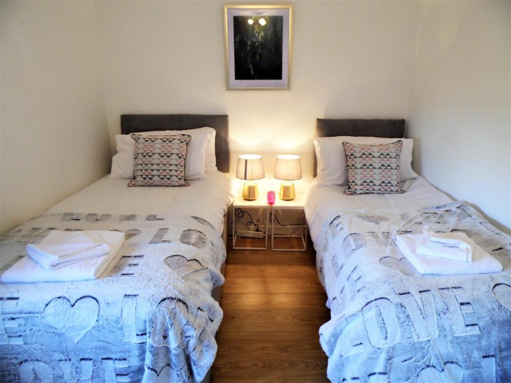 Voodi või voodid majutusasutuse Signature Apartments - Stanfield House toas