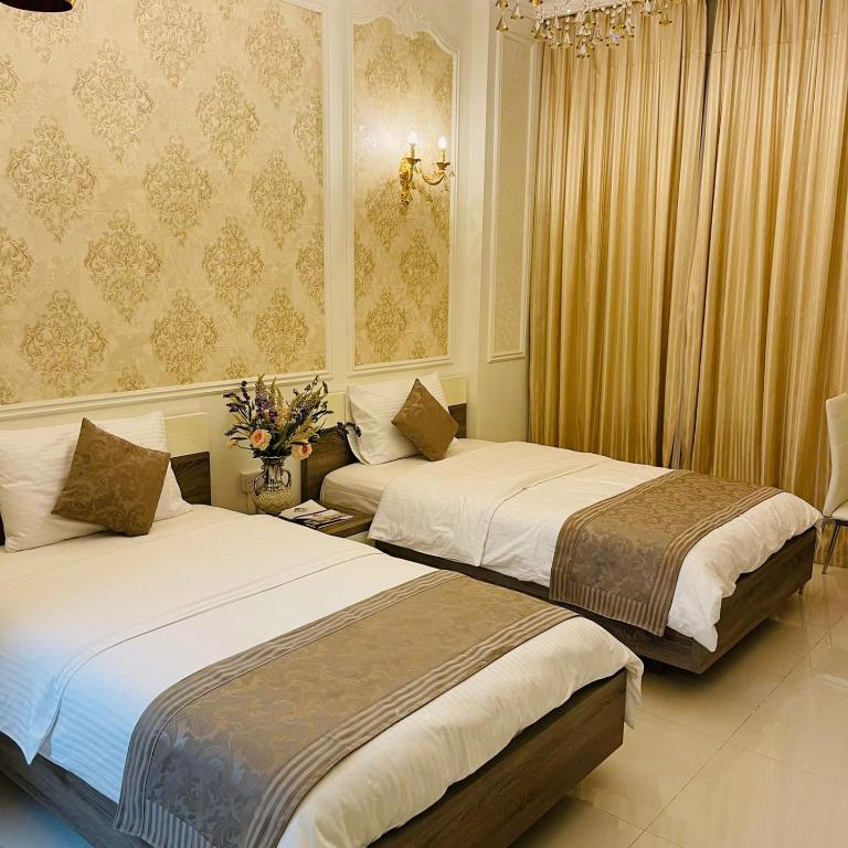 Postel nebo postele na pokoji v ubytování A'Sinamar Hotel Apartment