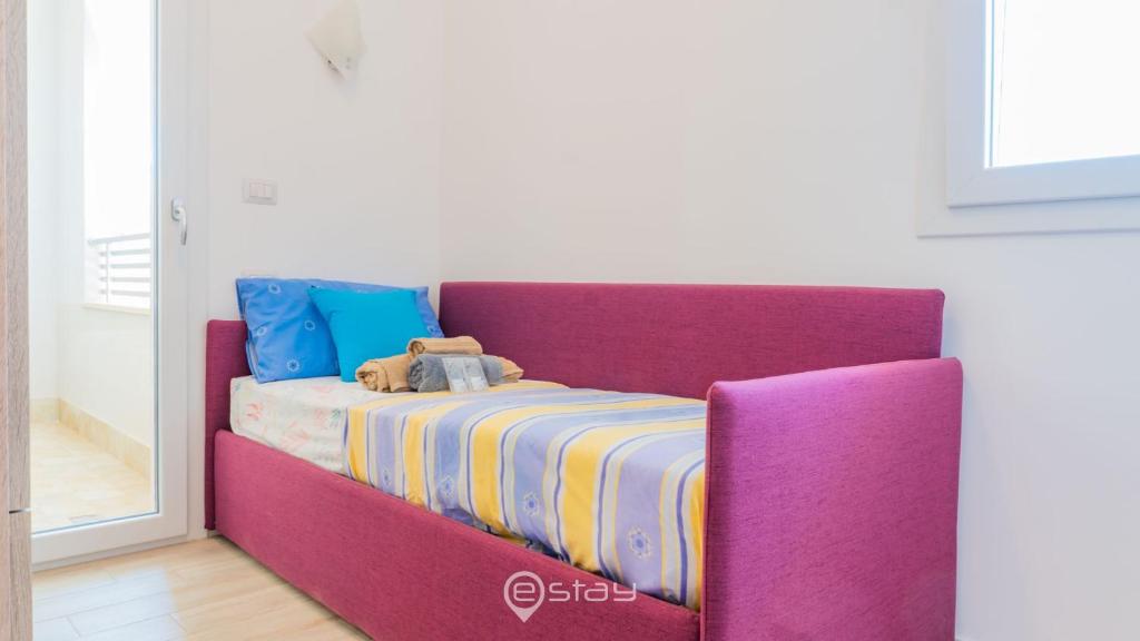 Łóżko lub łóżka w pokoju w obiekcie Cozy Apartment Alghero