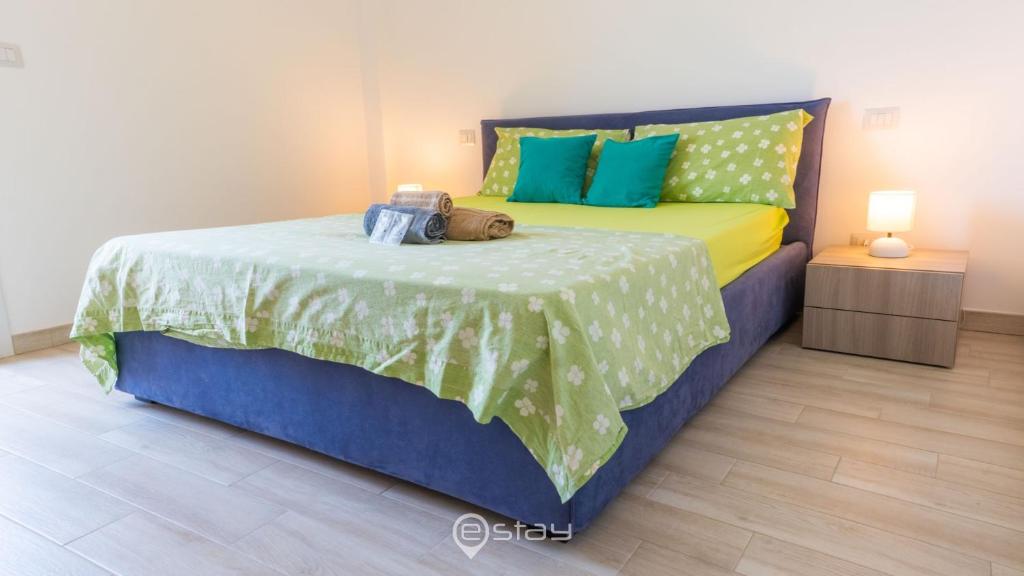 Łóżko lub łóżka w pokoju w obiekcie Cozy Apartment Alghero