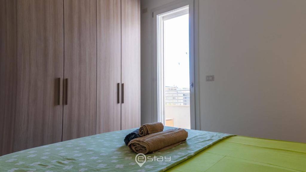 Łóżko lub łóżka w pokoju w obiekcie Cozy Apartment Alghero