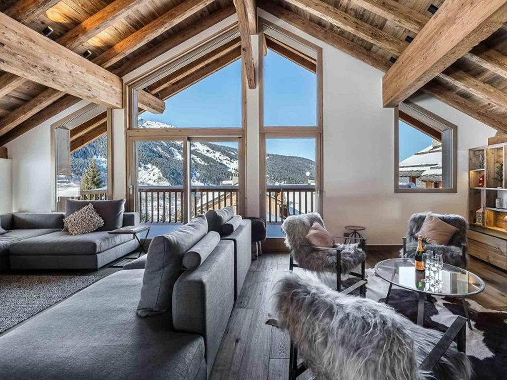 a living room with a couch and chairs and a table at Chalet Méribel, 7 pièces, 12 personnes - FR-1-566-30 in Les Allues