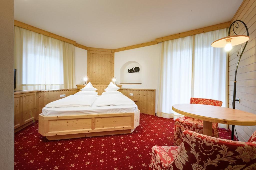 Postel nebo postele na pokoji v ubytování Hotel Ronce