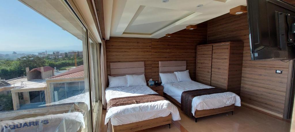 Postel nebo postele na pokoji v ubytování Aquarius Touristic Resort