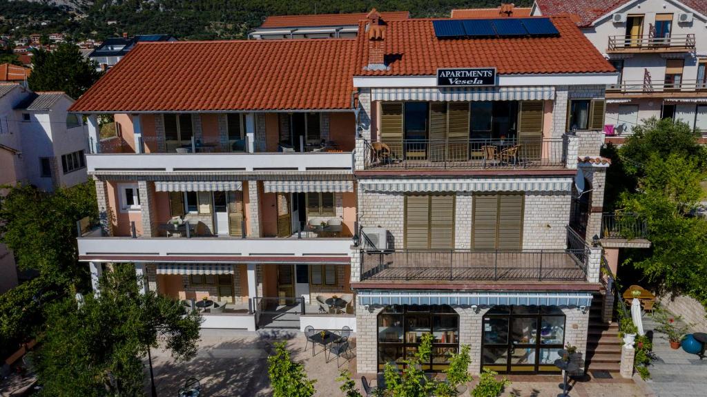 an aerial view of a house with a red roof at Apartments Vesela in Banjol