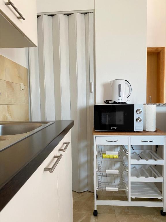 Kuchyň nebo kuchyňský kout v ubytování Apartman Patricia