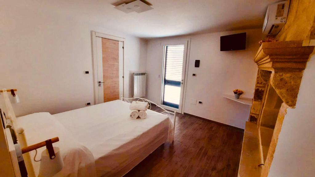 A bed or beds in a room at La Corte dei Marchesi