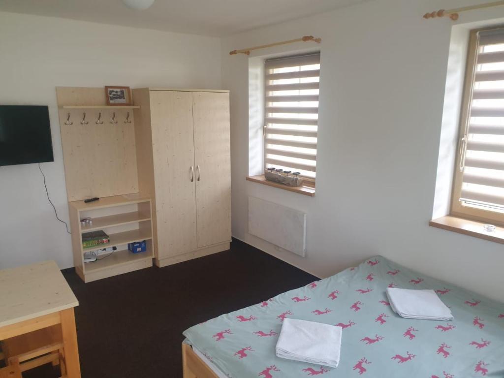 Postel nebo postele na pokoji v ubytování Apartmány Prášily