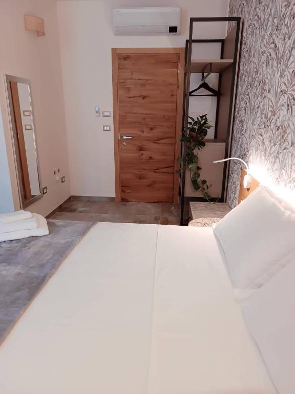 Postel nebo postele na pokoji v ubytování Le stanze di Diana
