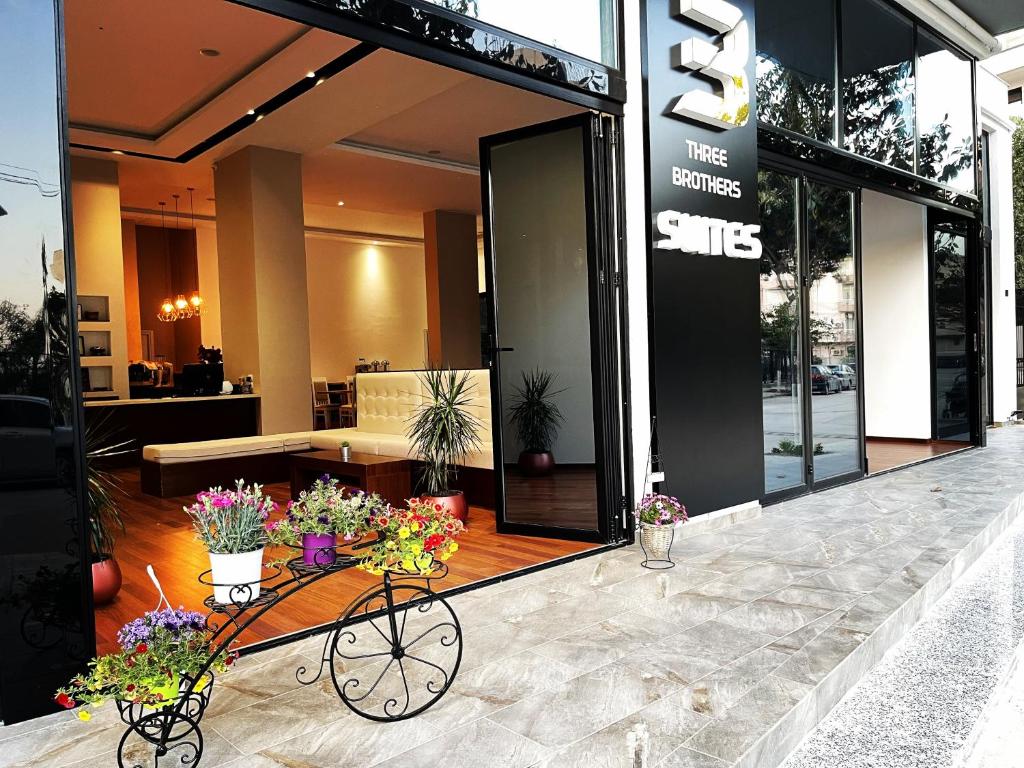 a flower cart in front of a store at 3B Suites Boutique Hotel in Sarandë