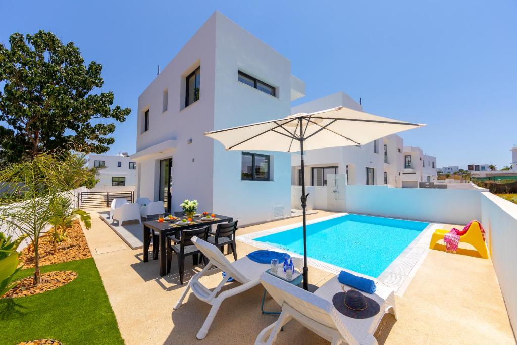 an image of a villa with a swimming pool at Alasia Villas in Paralimni