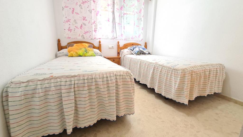 A bed or beds in a room at PALMERAS - Muy exclusivo y cerca de la playa!! Sólo familias