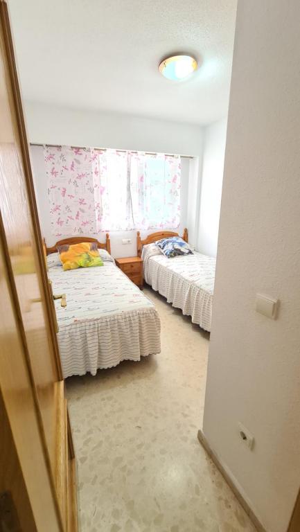 A bed or beds in a room at PALMERAS - Muy exclusivo y cerca de la playa!! Sólo familias