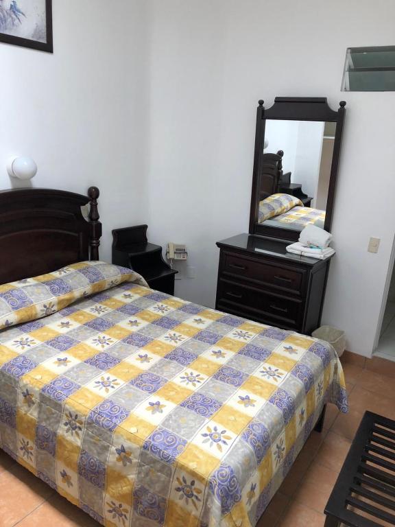 Postel nebo postele na pokoji v ubytování Hotel de los baños