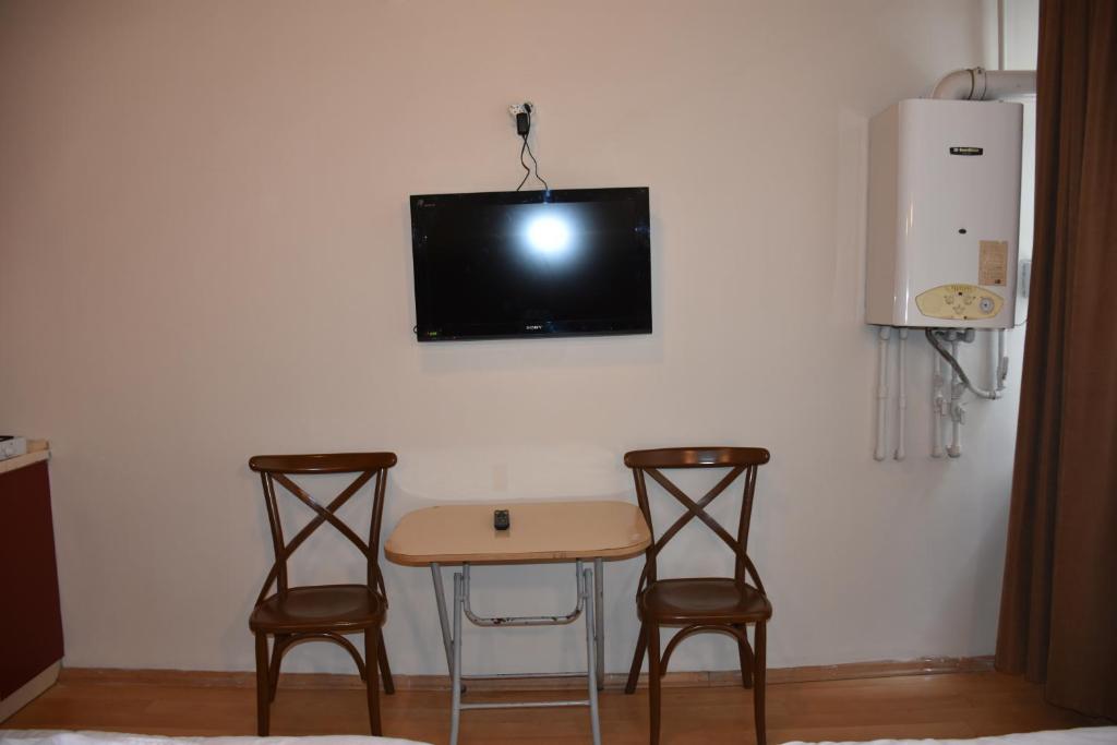 TV a/nebo společenská místnost v ubytování Taksim Palace Hotel