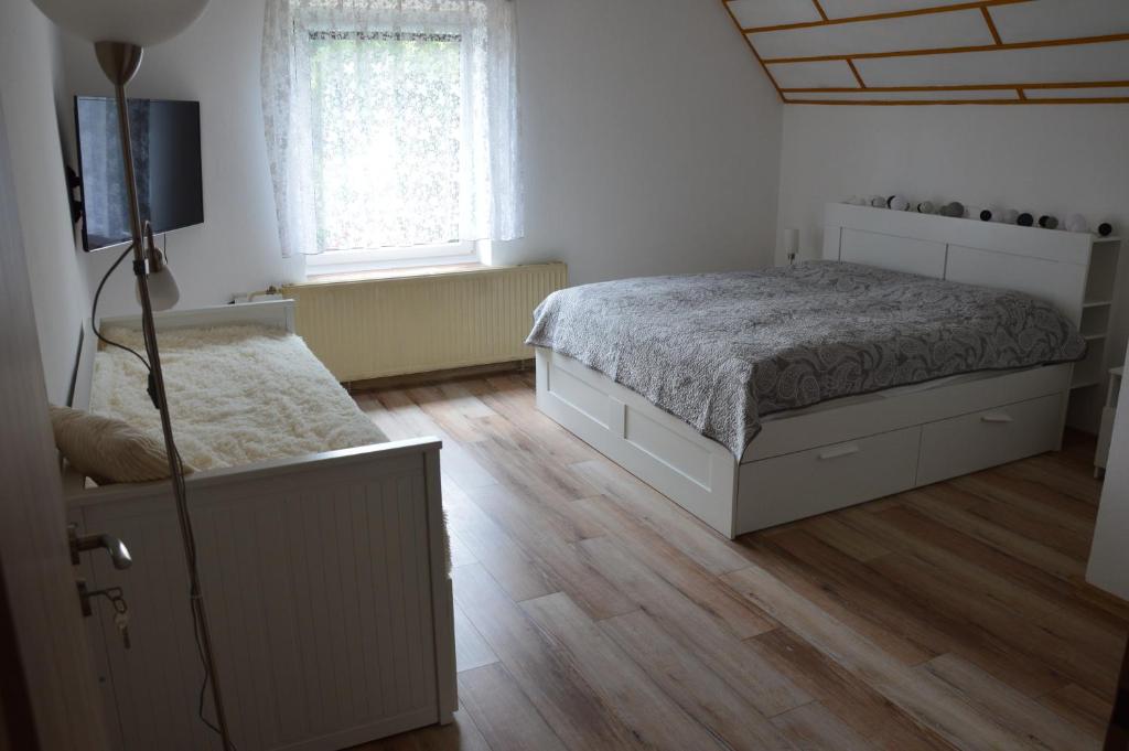 Postel nebo postele na pokoji v ubytování Horský apartmán Pod Zelenou Střechou