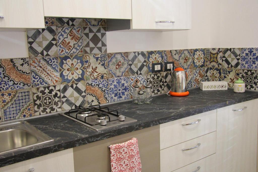 Kuchyň nebo kuchyňský kout v ubytování Apartments Capuana