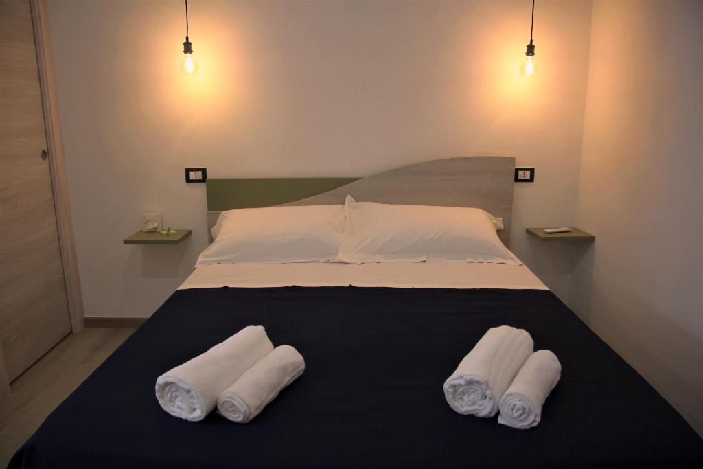 Postel nebo postele na pokoji v ubytování Apartments Capuana