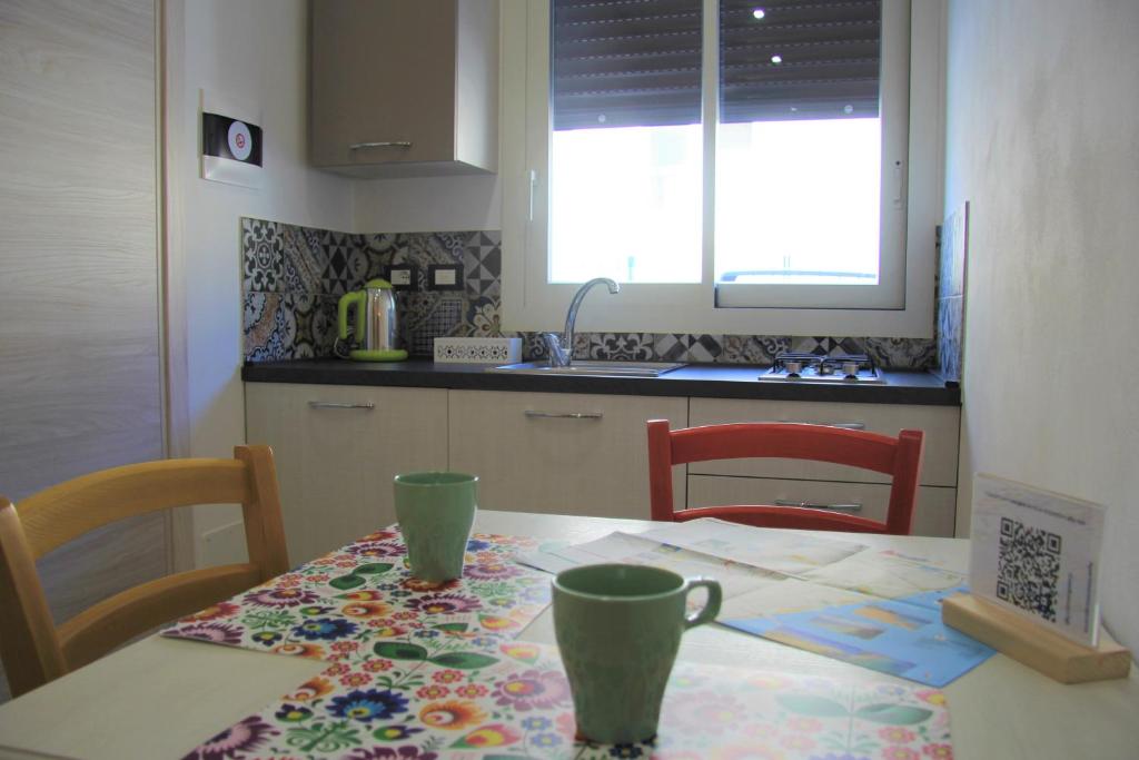 Kuchyň nebo kuchyňský kout v ubytování Apartments Capuana