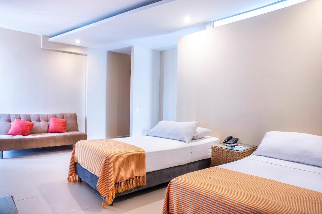 Letto o letti in una camera di Hotel Santorini Resort