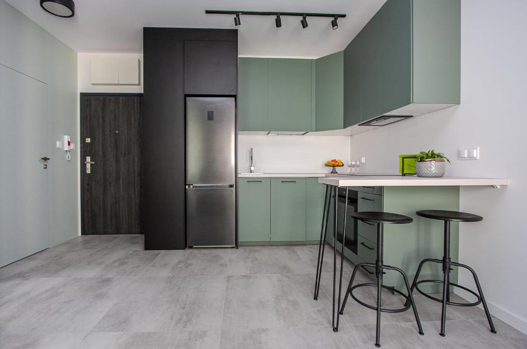 Kuchyňa alebo kuchynka v ubytovaní Urban Apartment Deluxe Kamienica Nova 3