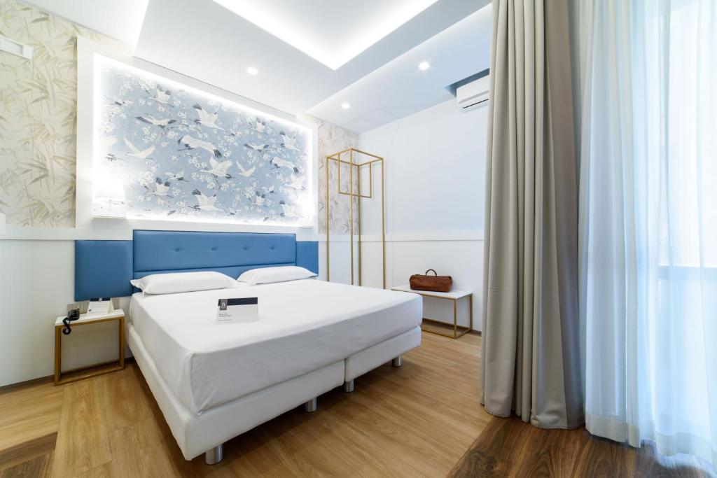 Postel nebo postele na pokoji v ubytování Hotel Palace