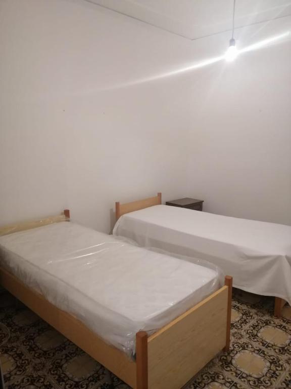 Łóżko lub łóżka w pokoju w obiekcie Casa Garri' Sciconi di Briatico
