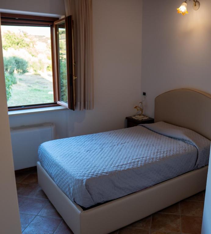 Posteľ alebo postele v izbe v ubytovaní Agriturismo Rende