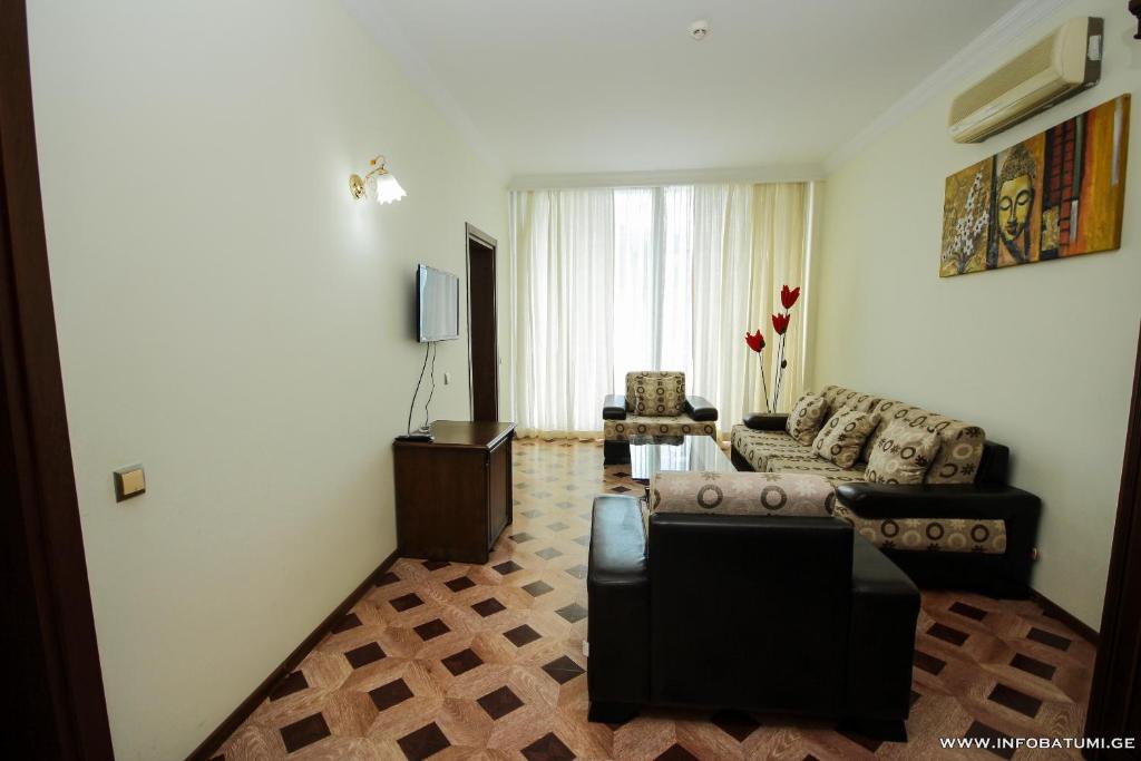 TV a/nebo společenská místnost v ubytování Hotel Cameo