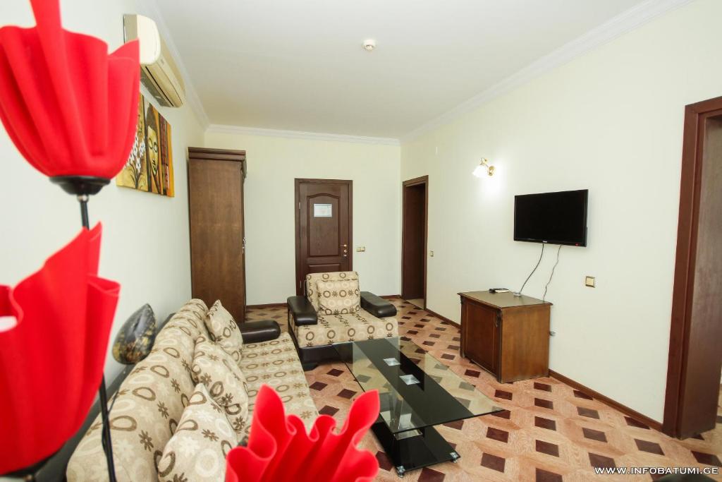 TV a/nebo společenská místnost v ubytování Hotel Cameo