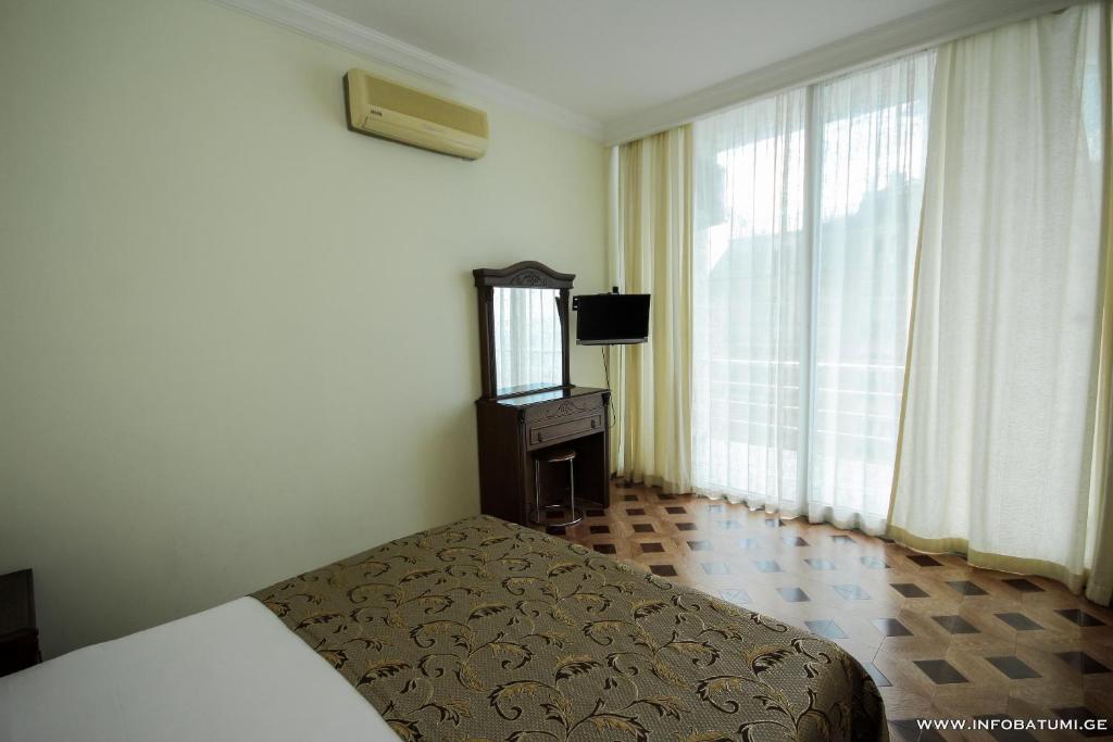 Postel nebo postele na pokoji v ubytování Hotel Cameo