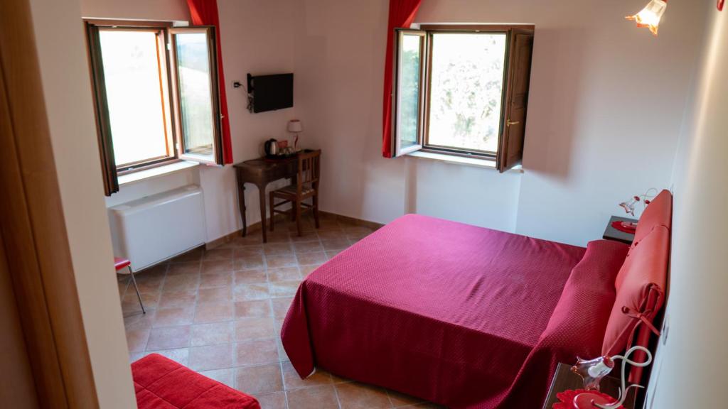 Posteľ alebo postele v izbe v ubytovaní Agriturismo Rende